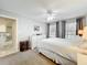 Bright bedroom with a large dresser and windows, featuring plush carpeting and a ceiling fan at 232 Afton Sq # 201, Altamonte Springs, FL 32714