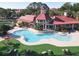 Resort-style pool with a sun deck, clubhouse, and lush landscaping at 232 Afton Sq # 201, Altamonte Springs, FL 32714