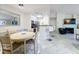 Open-concept dining area with modern finishes, adjacent to the kitchen and living area, offers a seamless flow for entertaining at 232 Afton Sq # 201, Altamonte Springs, FL 32714