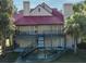 A charming two-story condo features a red roof, a staircase, and pleasant patio seating at 232 Afton Sq # 201, Altamonte Springs, FL 32714