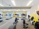 Bright and spacious gym featuring modern fitness equipment, mirrored walls, and natural light from large windows at 232 Afton Sq # 201, Altamonte Springs, FL 32714