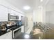 Updated kitchen with stainless steel appliances, stylish backsplash, and modern finishes at 232 Afton Sq # 201, Altamonte Springs, FL 32714