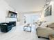 Stylish living room featuring a cozy fireplace, French doors, and contemporary decor at 232 Afton Sq # 201, Altamonte Springs, FL 32714