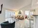 Bright and airy living room with vaulted ceilings and a view of the bedroom at 232 Afton Sq # 201, Altamonte Springs, FL 32714