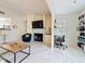 Well-designed living room with a sleek fireplace, comfortable seating, and a built-in desk at 232 Afton Sq # 201, Altamonte Springs, FL 32714