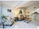 Comfortable living room with designer furnishings and seamless access to the dining area at 232 Afton Sq # 201, Altamonte Springs, FL 32714