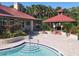 Pool area with lush landscaping near the clubhouse, offering a relaxing outdoor space at 232 Afton Sq # 201, Altamonte Springs, FL 32714