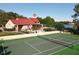 Enjoy a match on this well-maintained tennis court with a clubhouse, pool, and lake in the background at 232 Afton Sq # 201, Altamonte Springs, FL 32714