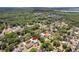 Expansive aerial view of a neighborhood surrounded by lush green landscapes with nearby lakes and waterways at 255 Katrina St, De Leon Springs, FL 32130