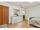 Neutral bedroom offering a large closet, wood floors, and bright natural light at 255 Katrina St, De Leon Springs, FL 32130