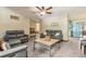 A view of a living room and entry hallway with gray sofas and a tile floor at 255 Katrina St, De Leon Springs, FL 32130