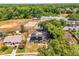 Aerial view of the property showcasing a house with solar panels, large lot, and community amenities nearby at 260 3Rd St, Winter Springs, FL 32708