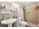 Bathroom featuring a pedestal sink, tiled shower, and neutral decor at 260 3Rd St, Winter Springs, FL 32708