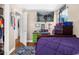 Bedroom featuring a television, work station, closet, and window with blue fan at 260 3Rd St, Winter Springs, FL 32708