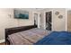 This bedroom has a large bed, closet, and a TV mounted on the wall at 260 3Rd St, Winter Springs, FL 32708