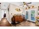 Dining area with wood-look floors, ceiling fan, and double doors leading to the outside at 260 3Rd St, Winter Springs, FL 32708
