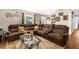 Comfortable living room featuring a large sectional sofa, patterned rug, and bright window at 260 3Rd St, Winter Springs, FL 32708