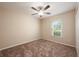 Bedroom featuring neutral walls, carpet, ceiling fan, and a window that provides natural light at 2611 Albion Ave, Orlando, FL 32833