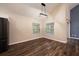 Dining area with wood floors, bright windows, and modern lighting fixture near the kitchen and living areas at 2611 Albion Ave, Orlando, FL 32833