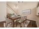 Dining room with wood floors, elegant table setting, modern decor, and a staircase in the background at 2611 Albion Ave, Orlando, FL 32833