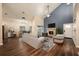 Bright living room with vaulted ceilings, fireplace, and wood-look floors, creating a modern and inviting space at 2611 Albion Ave, Orlando, FL 32833
