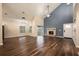 Spacious living room features a fireplace, high ceilings, and dark wood-look flooring at 2611 Albion Ave, Orlando, FL 32833