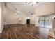 Bright living room showcases dark wood-look flooring, high ceilings, and sliding glass doors at 2611 Albion Ave, Orlando, FL 32833