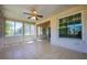 Enclosed sunroom with tiled floor features windows overlooking the backyard at 2611 Albion Ave, Orlando, FL 32833