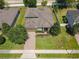 Aerial view of a well-maintained single-Gathering home with a brick driveway at 2983 Park Meadow Dr, Apopka, FL 32703