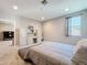 Inviting bedroom featuring a built-in desk area, large window, and neutral decor at 2983 Park Meadow Dr, Apopka, FL 32703