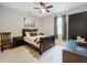 Bedroom with a dark wood bed and gray decor at 2983 Park Meadow Dr, Apopka, FL 32703