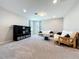 Upstairs bonus room with carpeting, sofas, and a tv console at 2983 Park Meadow Dr, Apopka, FL 32703