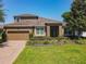 Charming one-story home featuring a well-manicured lawn and attractive landscaping in a desirable neighborhood at 2983 Park Meadow Dr, Apopka, FL 32703