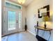 Bright foyer with transom windows above the door, tiled floors, and neutral walls at 2983 Park Meadow Dr, Apopka, FL 32703