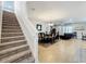 Interior showcasing stairs and an open-concept living and dining area at 2983 Park Meadow Dr, Apopka, FL 32703