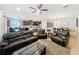 Inviting living room with comfortable seating, tile floors, and an open layout at 2983 Park Meadow Dr, Apopka, FL 32703