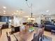 Open floor plan with kitchen, dining area, and living room, creating a seamless flow at 2983 Park Meadow Dr, Apopka, FL 32703