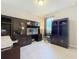 Office area with dark wood cabinetry and light-colored floors at 2983 Park Meadow Dr, Apopka, FL 32703