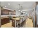 Modern kitchen featuring stainless steel appliances, granite countertops, a spacious island, and eat in bar at 3065 Timber Hawk Cir, Ocoee, FL 34761