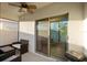 Screened patio showing outdoor seating and a grill, with access to the interior through a sliding glass door at 3065 Timber Hawk Cir, Ocoee, FL 34761