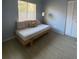 Comfortable bedroom featuring natural light from a window, laminate floors, and closet at 3124 Ginger Cir, Orlando, FL 32826