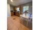 Kitchen with dining area offering tile floors, wood cabinets, and lots of sunlight at 3124 Ginger Cir, Orlando, FL 32826