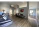 Spacious living room with vaulted ceilings, laminate flooring, and modern decor at 3124 Ginger Cir, Orlando, FL 32826