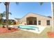 Backyard oasis with a sparkling pool, spa, and privacy provided by mature palm trees at 3200 Town And Country Rd, Oviedo, FL 32766
