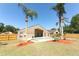 Large, fully fenced backyard featuring a sparkling pool, covered patio, and mature trees at 3200 Town And Country Rd, Oviedo, FL 32766