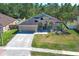 Charming single-story home featuring a well-manicured lawn and a two-car garage at 3200 Town And Country Rd, Oviedo, FL 32766