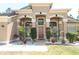 Stunning front entrance boasts beautiful landscaping and a welcoming design at 3200 Town And Country Rd, Oviedo, FL 32766