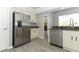 Stainless steel appliances, granite countertops, and ample cabinet space enhance this functional kitchen at 3200 Town And Country Rd, Oviedo, FL 32766