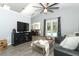 Comfortable living room with a leather sectional, an entertainment center, and views of the outdoor pool at 3200 Town And Country Rd, Oviedo, FL 32766