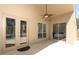 Covered patio with ceiling fan and views of the sparkling pool and lush backyard at 3200 Town And Country Rd, Oviedo, FL 32766